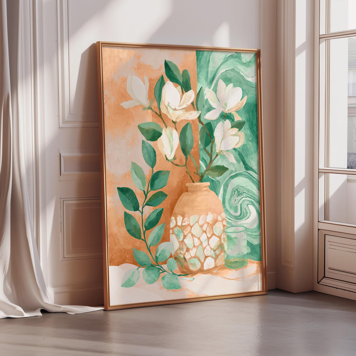 a large framed painting of a vase with flowers and leaves, placed on a white wall near a window.
