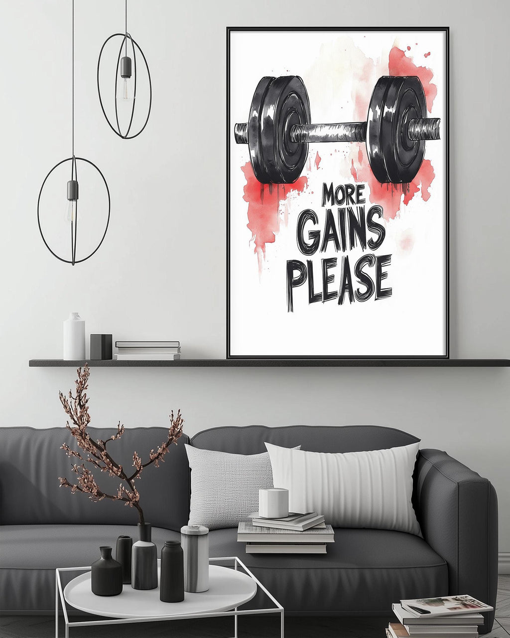 a living room with a gray couch, a coffee table, and a framed poster with a weightlifting illustration and the text "MORE GAINS PLEASE" above it.