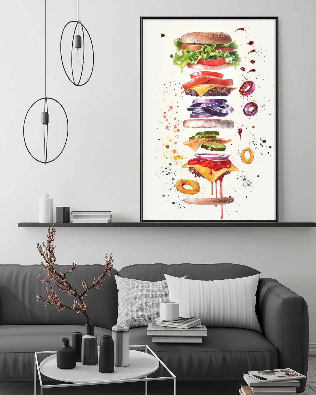 a large, colorful painting of a hamburger on a white wall above a gray couch in a living room setting.