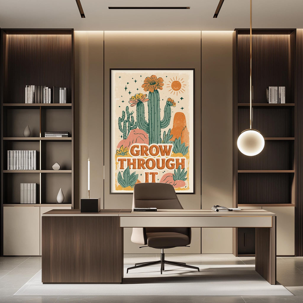 a modern office space with a large framed poster on the wall that says "GROW THROUGH IT". The office has a wooden desk, a chair, and a bookshelf filled with books. The overall design and decor create a professional and inspiring atmosphere.