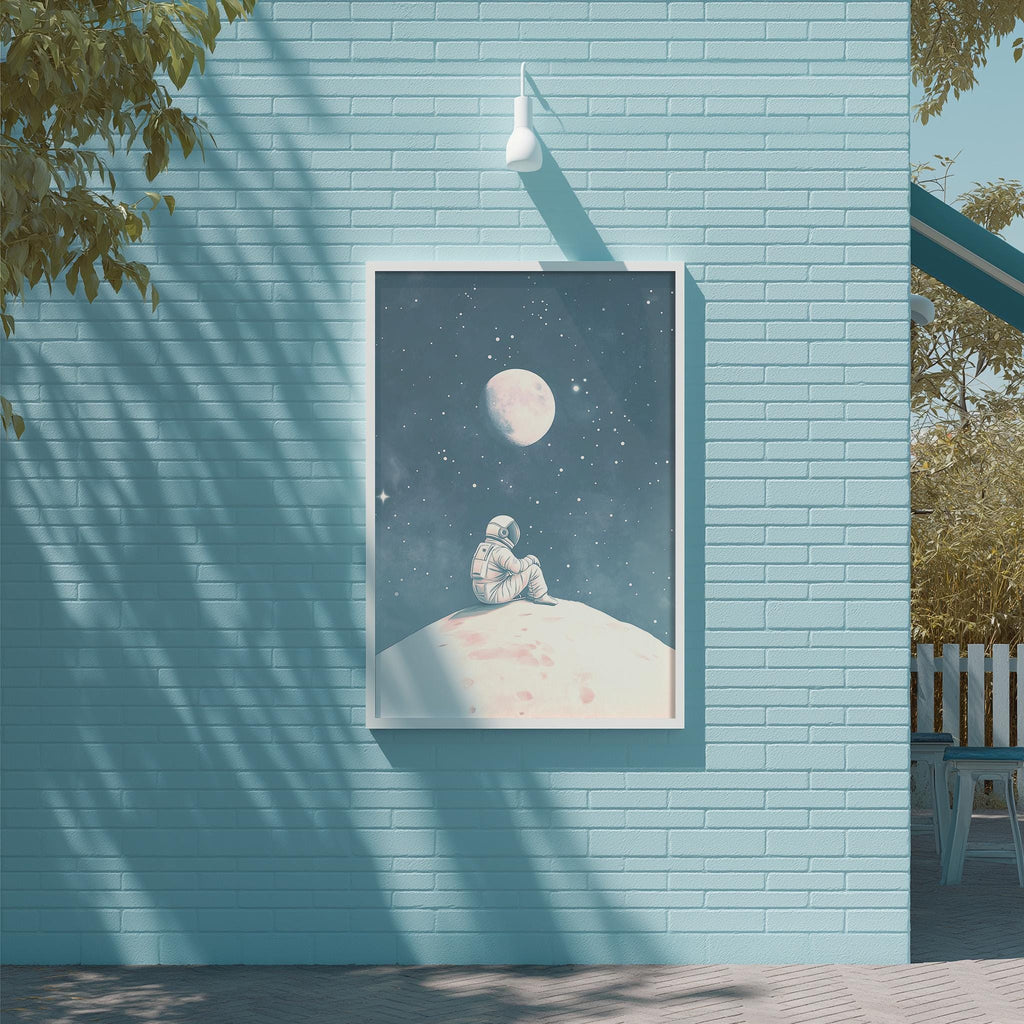 a blue brick wall with a framed picture of an astronaut sitting on a white surface, gazing up at the night sky with a full moon and stars.