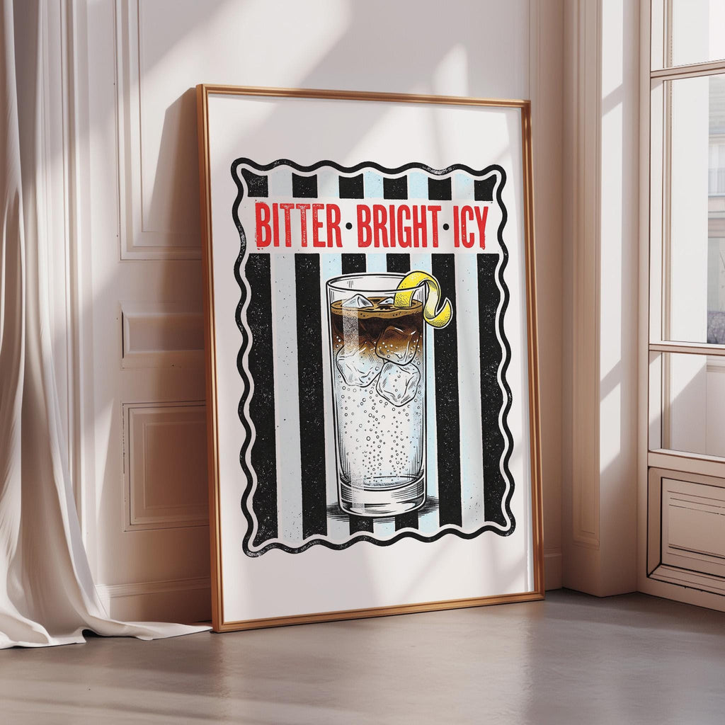 a framed illustration of a glass with a lemon slice, accompanied by the text "BITTER-BRIGHT-ICY" in bold red letters.