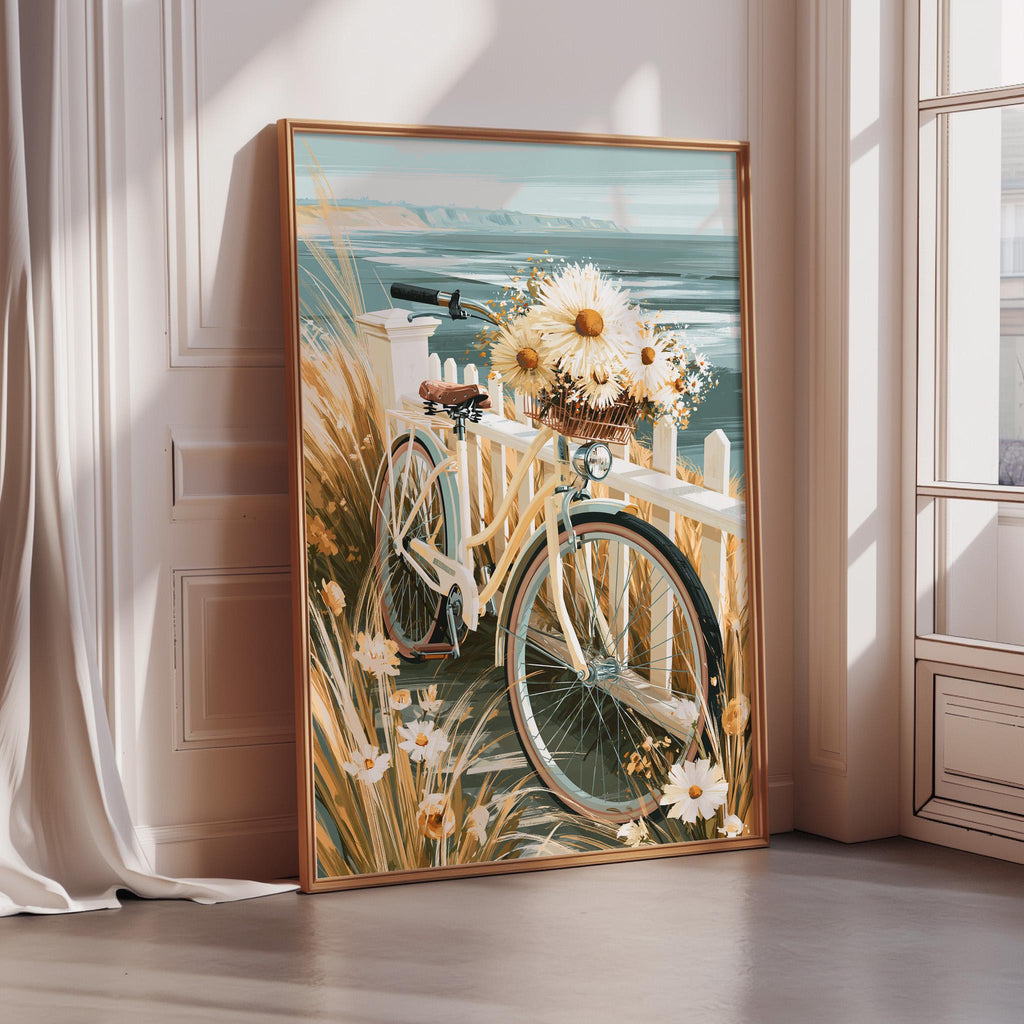 A framed painting depicting a bicycle with a basket of flowers, set against a scenic background of a grassy area and a body of water.