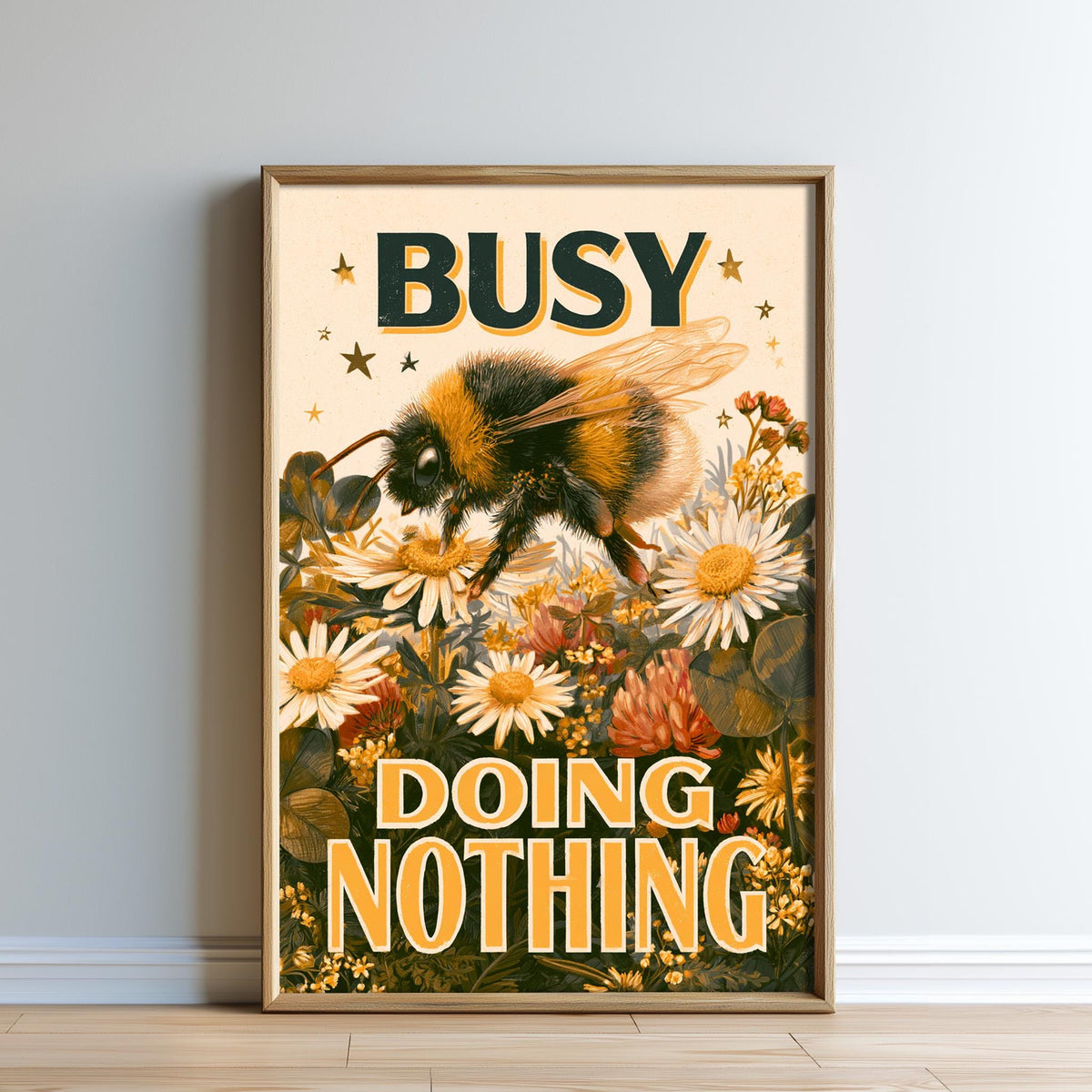 The image is a framed poster with a bee and flowers, along with the text "BUSY DOING NOTHING".
