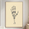 a living room with a large framed illustration of a human hand on the wall.