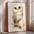 a large framed painting of a white owl with brown eyes and a white belly, perched on a branch.