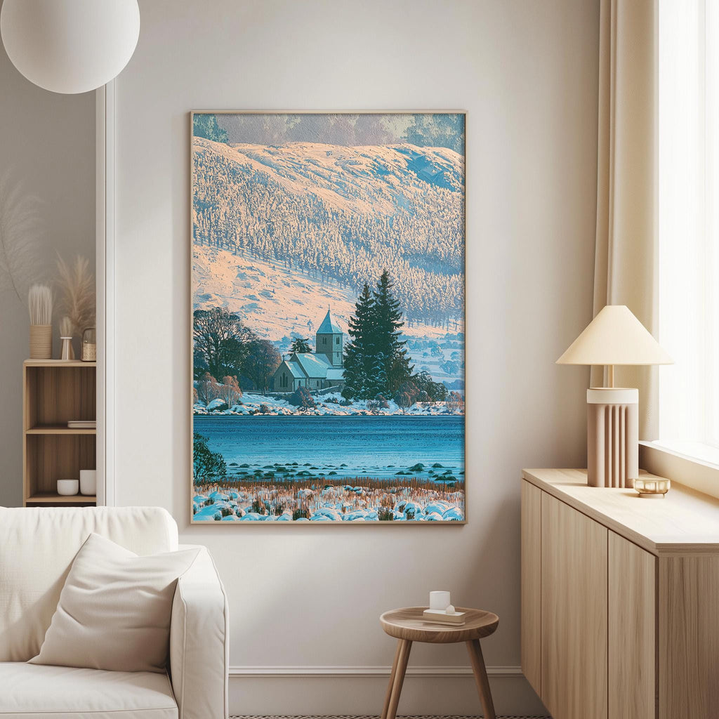 a large framed picture of a snowy landscape with a church in the background, hanging on a wall in a living room.