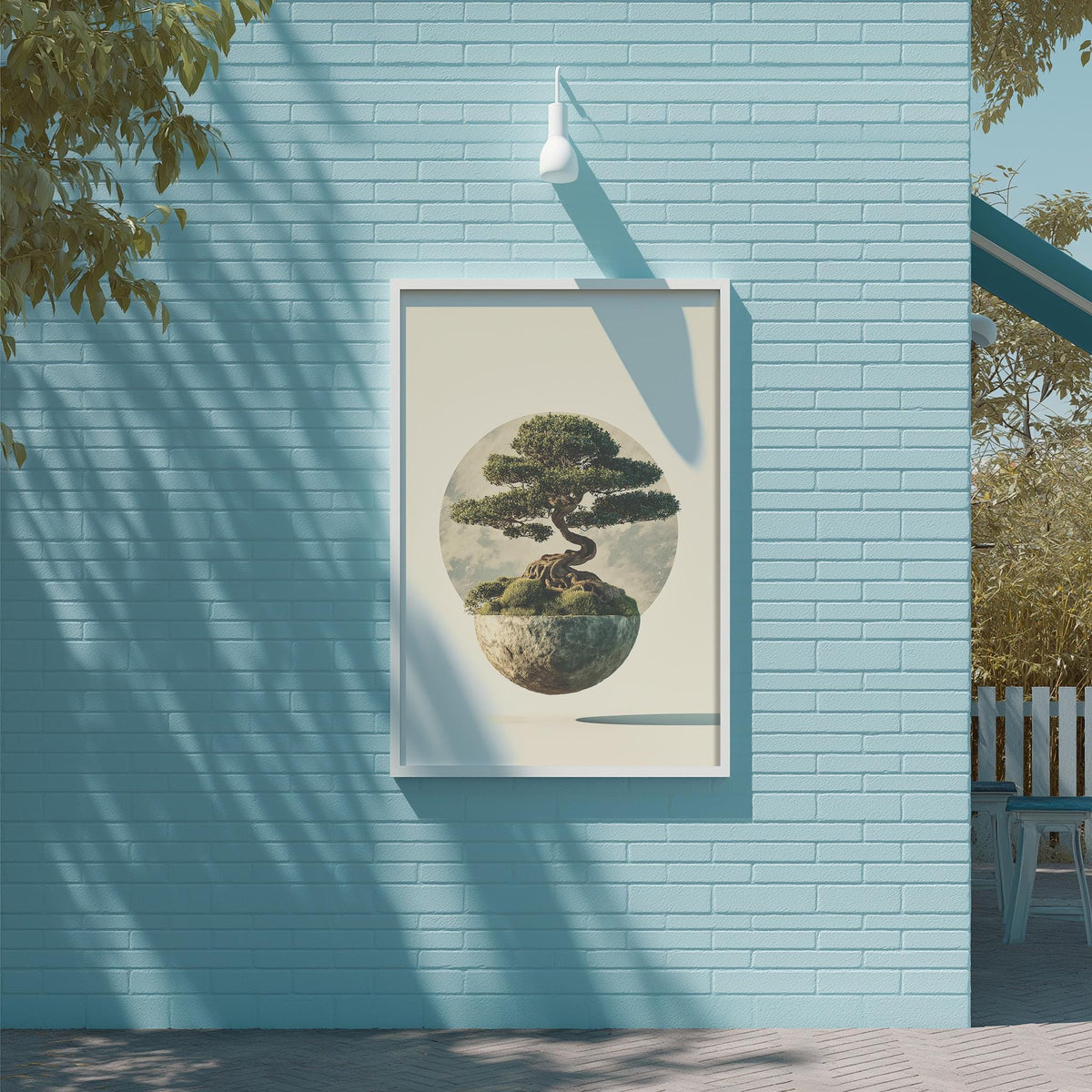 a blue brick wall with a framed painting of a bonsai tree hanging on it.
