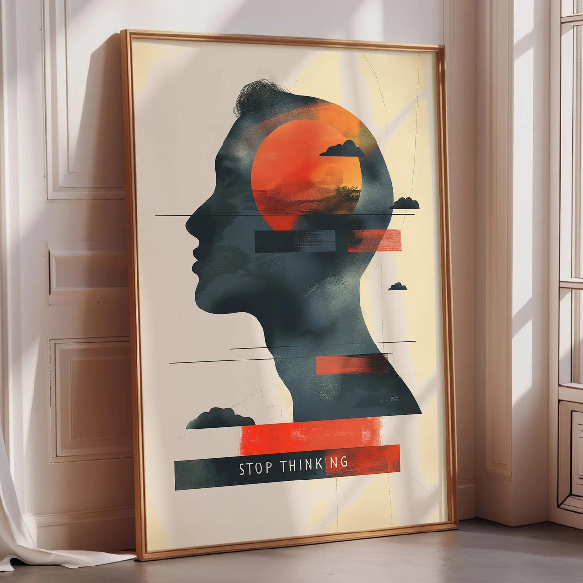 The image is a framed poster with a silhouette of a person's head and a large orange circle, along with the text "STOP THINKING" displayed prominently.