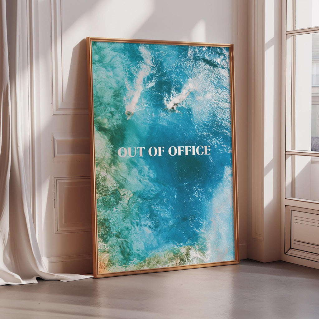 a large framed poster with the text "OUT OF OFFICE" prominently displayed on it.