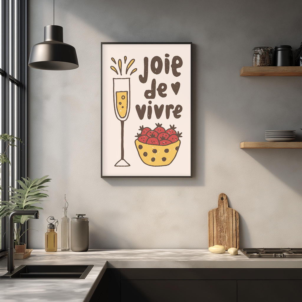 a kitchen counter with various kitchen items, including a framed poster with a wine glass and a bowl of strawberries, a wooden cutting board, and a potted plant.