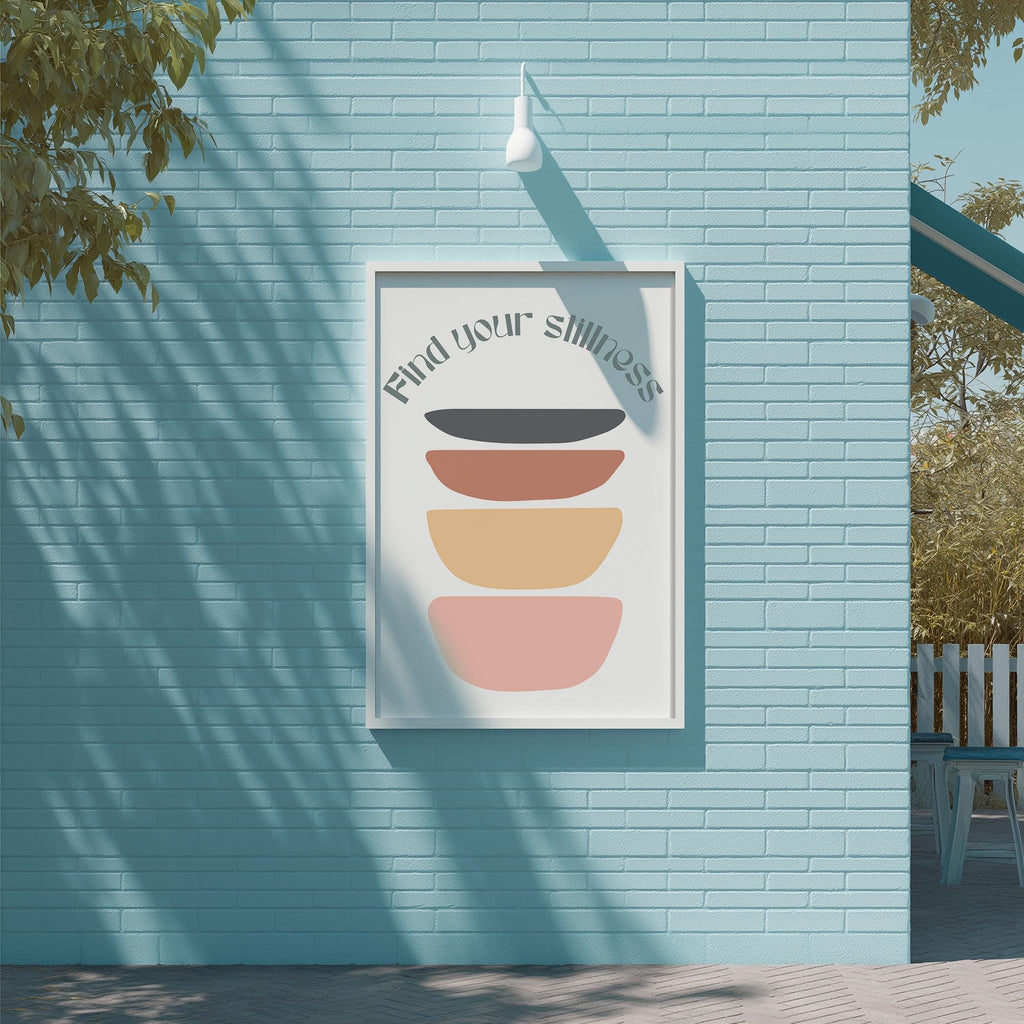 a blue brick wall with a framed poster hanging on it. The poster has a colorful design with a message that reads "Find your silliness".