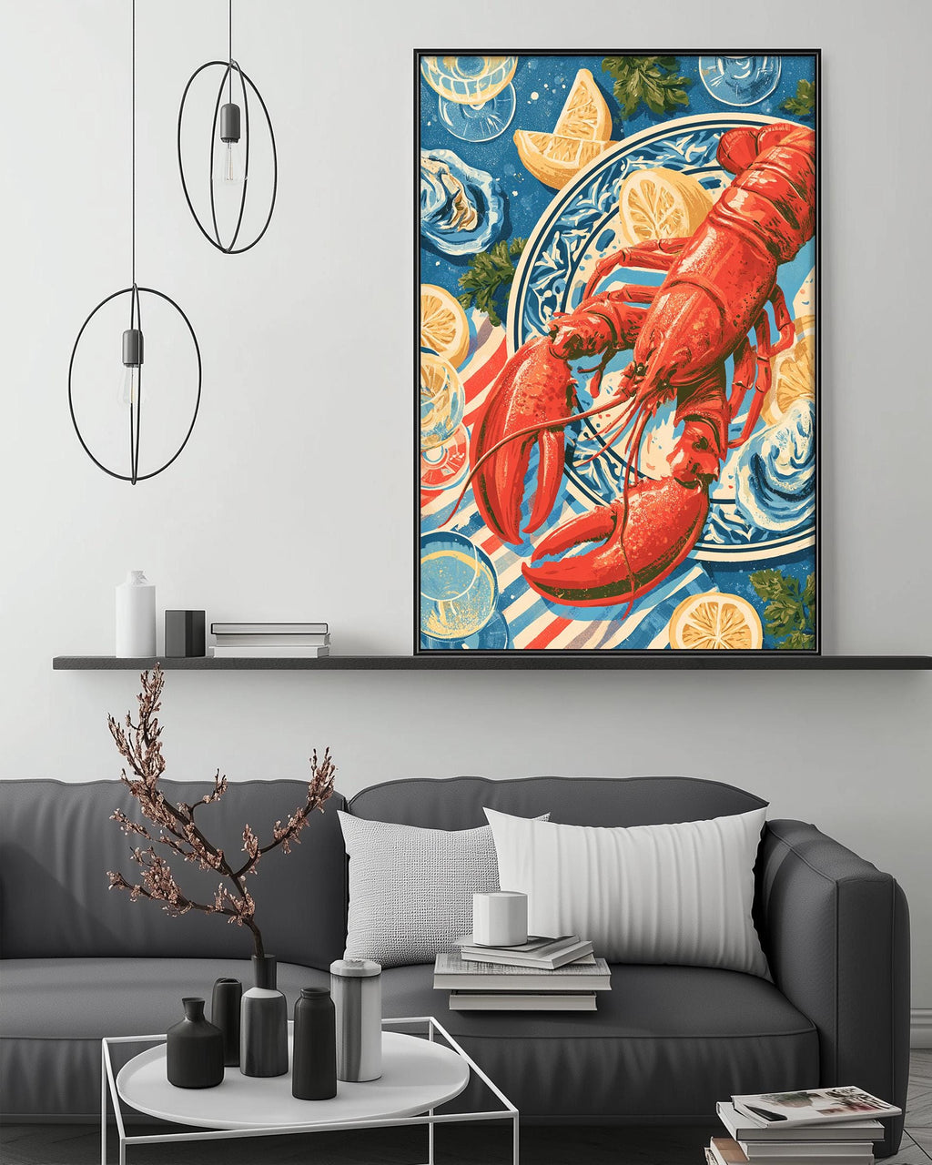 a large framed artwork of a lobster on a blue and white plate, hanging on a wall above a gray couch with a coffee table in front of it.