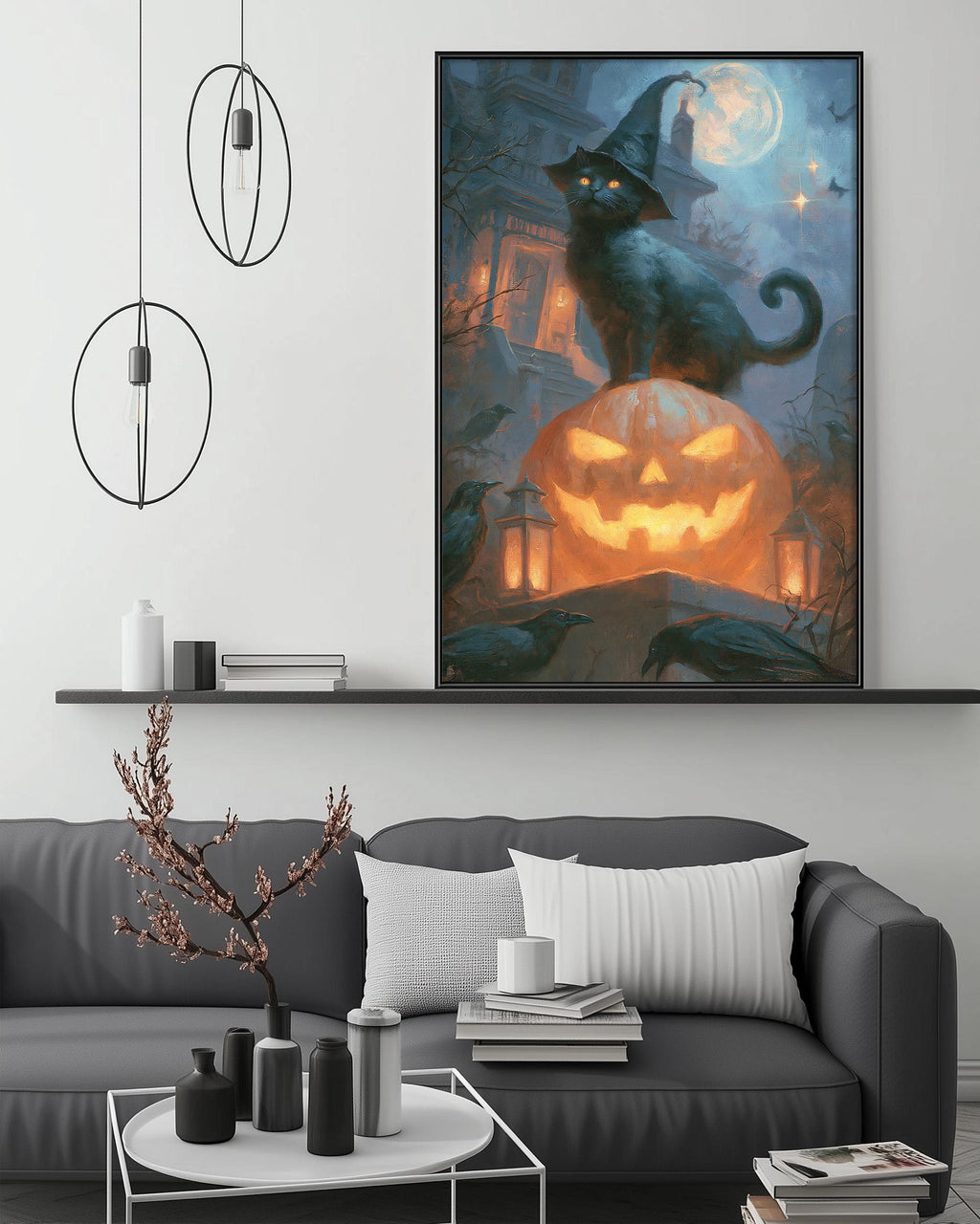 a large Halloween-themed painting of a black cat sitting on a jack-o-lantern, surrounded by bats and other spooky elements. The painting is displayed on a wall above a gray couch, which has a coffee table in front of it. The room has a minimalist and modern decor, with a pendant light hanging above the couch and a shelf below the painting.