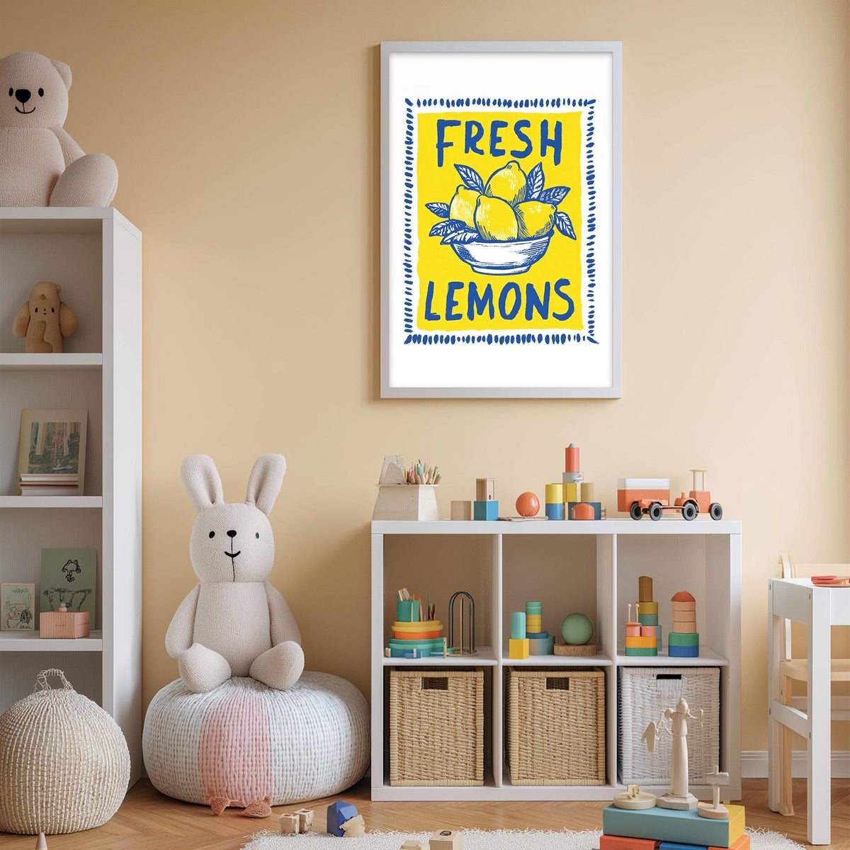A child's bedroom with a white bookshelf, a stuffed rabbit, and a colorful toy box filled with various toys. Above the bookshelf is a framed poster with the text "FRESH LEMONS" and an illustration of lemons in a bowl.