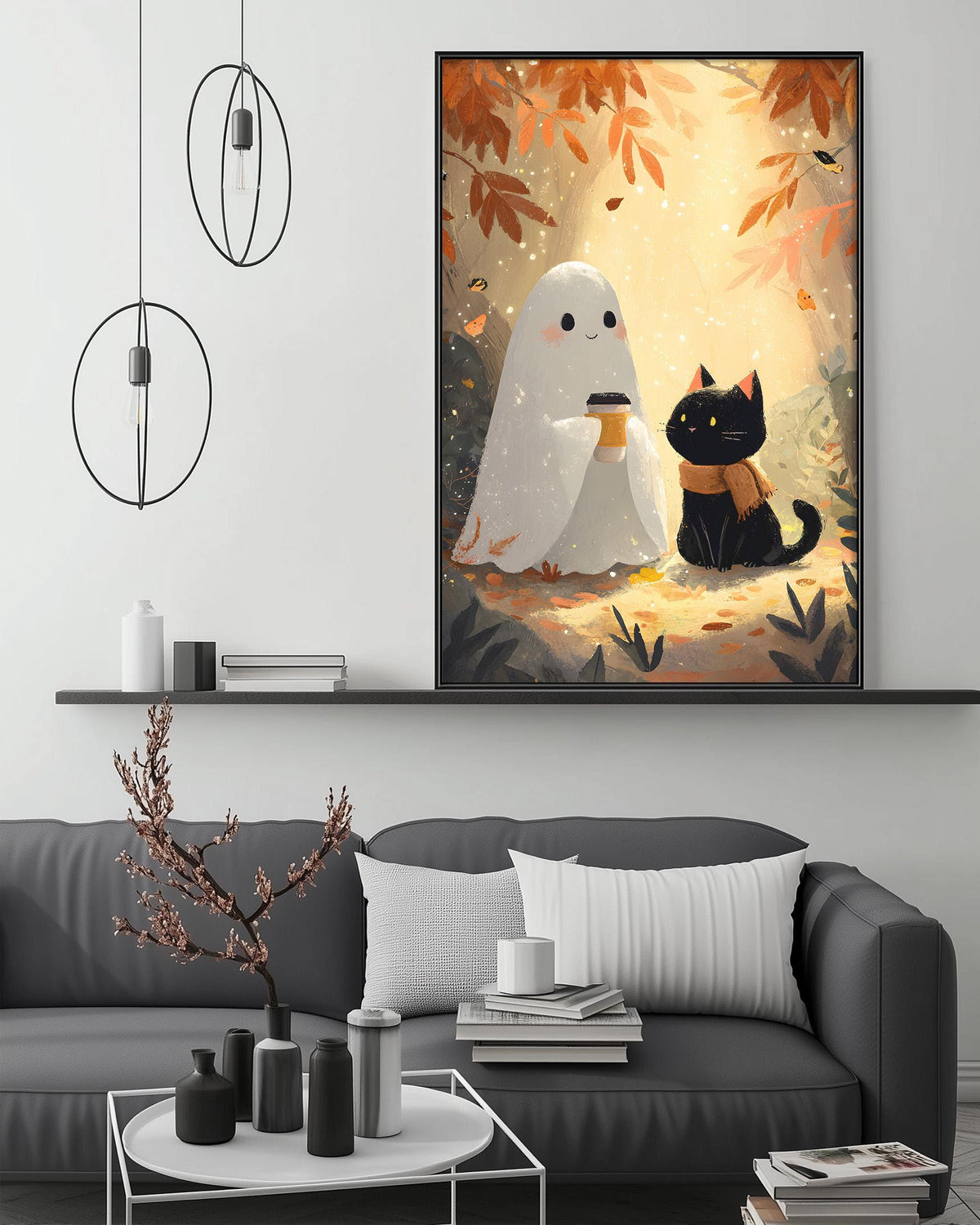a cozy living room with a gray sofa, a coffee table, and a large framed illustration of a ghost and a cat on the wall.