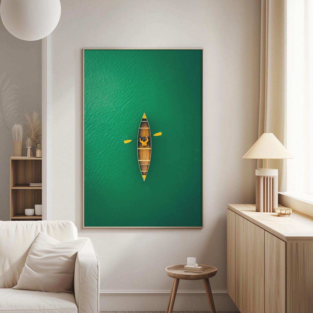 a cozy living room with a large green painting hanging on the wall, featuring a canoe on a serene body of water. The room is furnished with a white sofa, a wooden side table, and a lamp, creating a warm and inviting atmosphere.