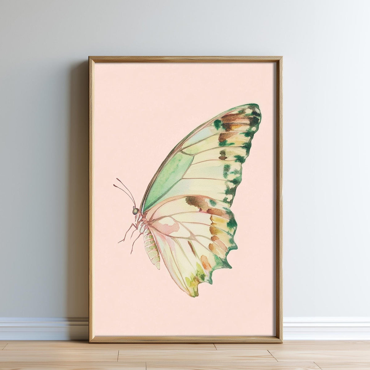 A framed watercolor painting of a colorful butterfly with a pink background.