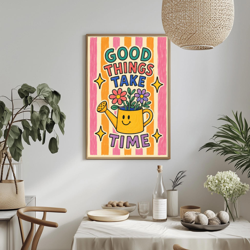 a colorful poster with a smiling yellow watering can and the text "GOOD THINGS TAKE TIME" displayed on a wall above a table with various items on it.