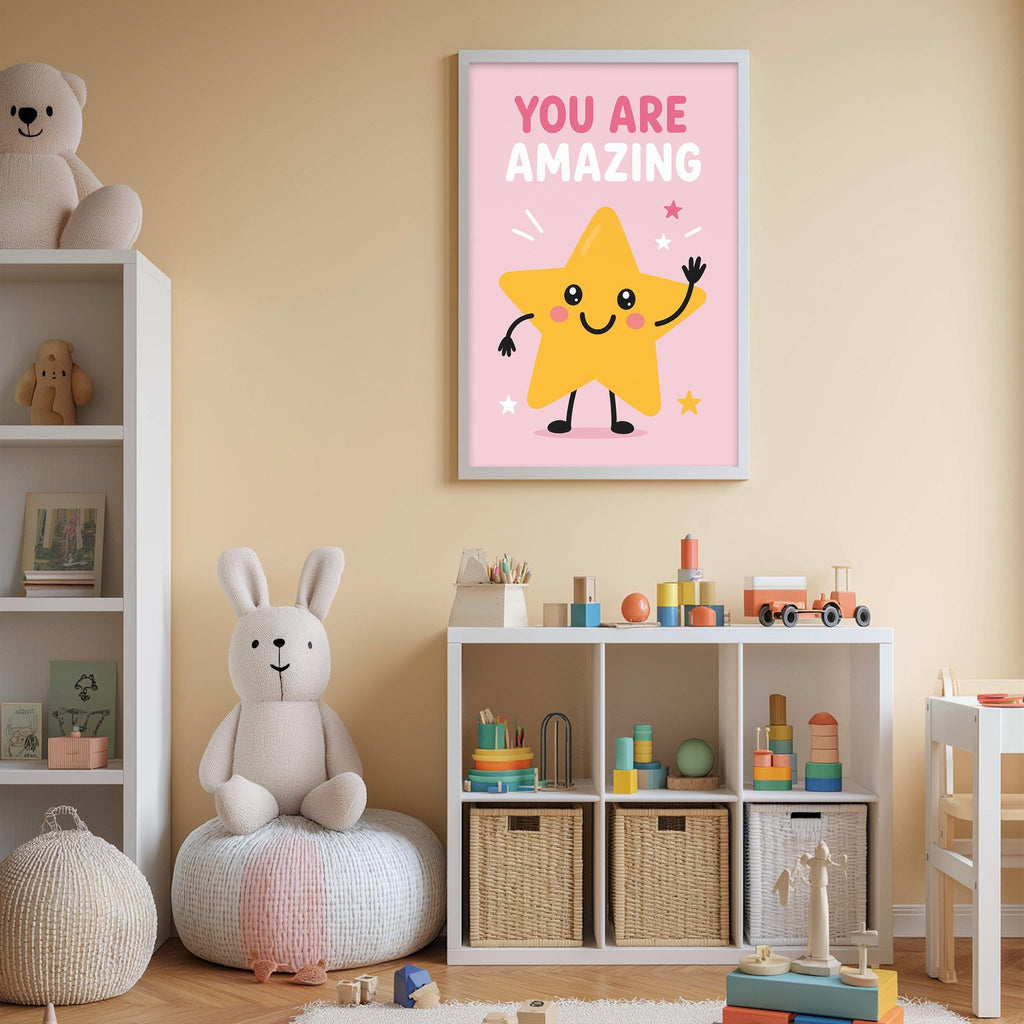 A child's bedroom with a pink wall, featuring a framed poster with a cartoon star character and the text "YOU ARE AMAZING". The room also contains a bookshelf, a bean bag chair, and various toys and storage bins.