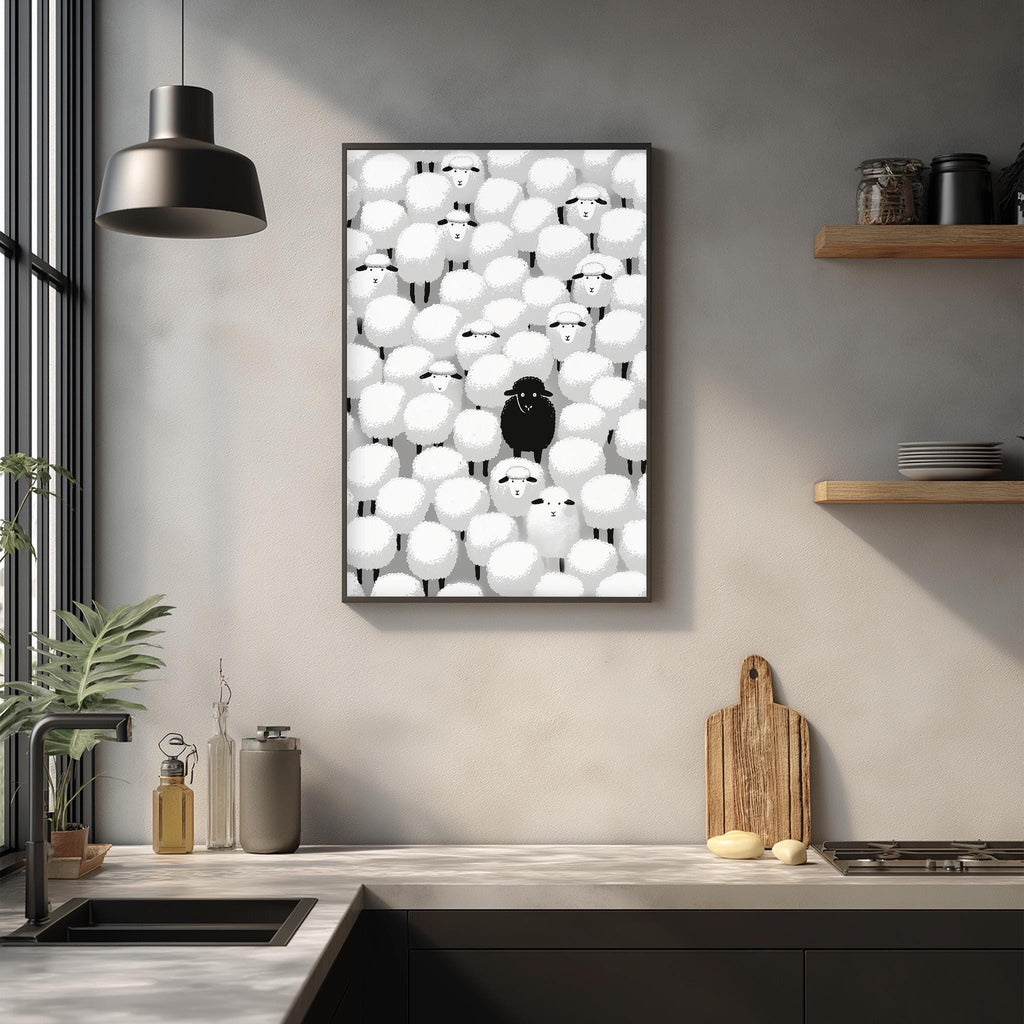 a kitchen counter with various kitchen items, including a cutting board, a bottle, and a bowl. Above the counter, there is a framed artwork depicting a group of sheep with a single black sheep standing out from the rest.
