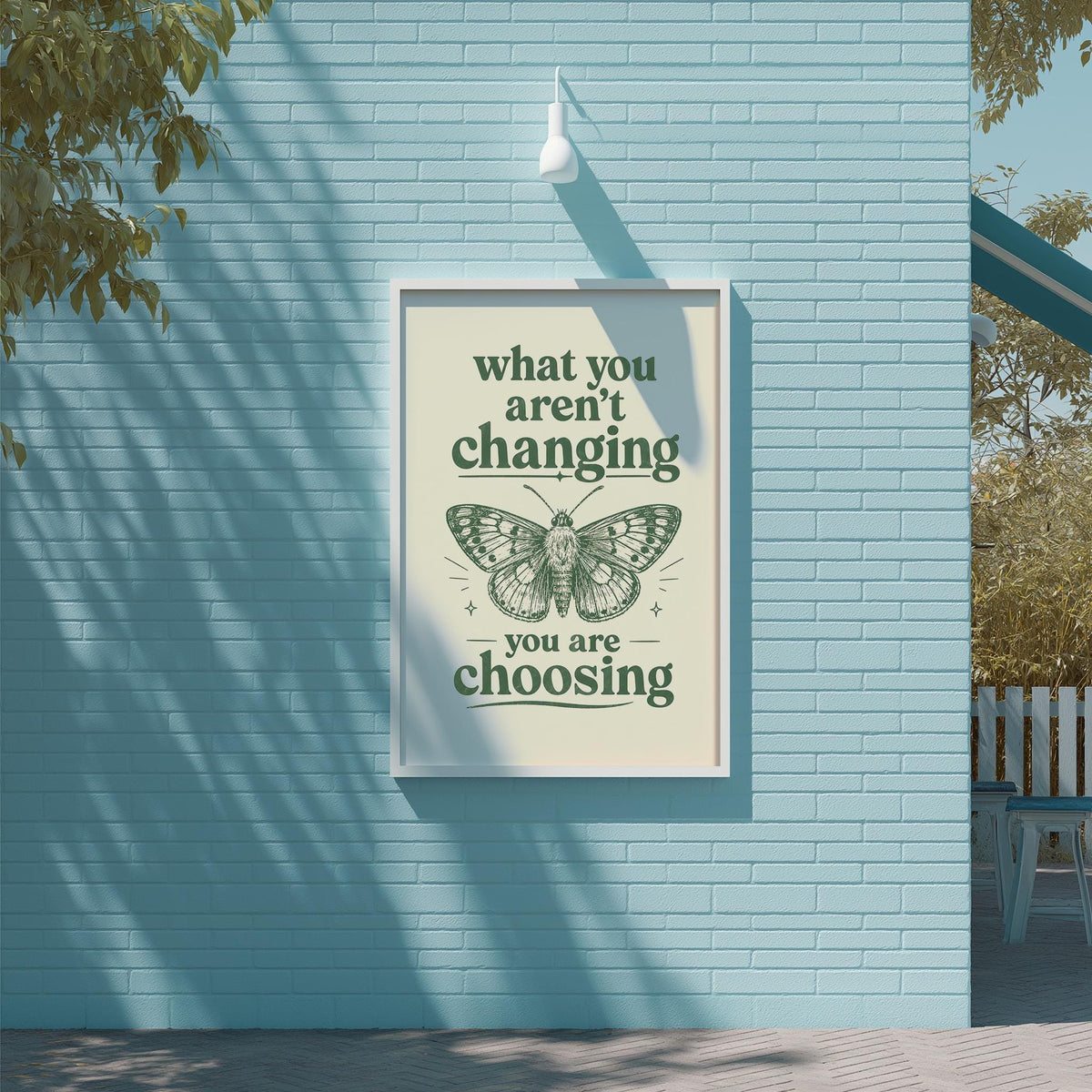 a poster with the text "what you aren't changing, you are choosing" and an illustration of a butterfly.