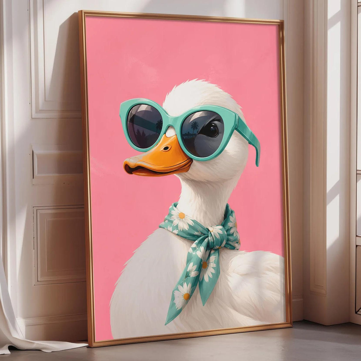 A framed illustration of a duck wearing sunglasses and a scarf is displayed on a wall.