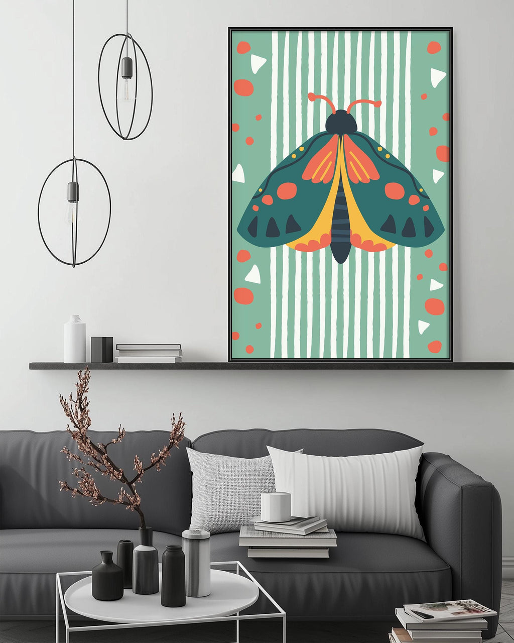 a modern living room with a gray sofa, a coffee table, and a large framed print of a colorful butterfly on the wall.