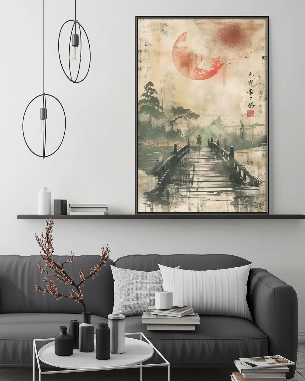a modern living room with a gray sofa, a coffee table, and a large framed artwork depicting a serene landscape with a bridge and a red moon.