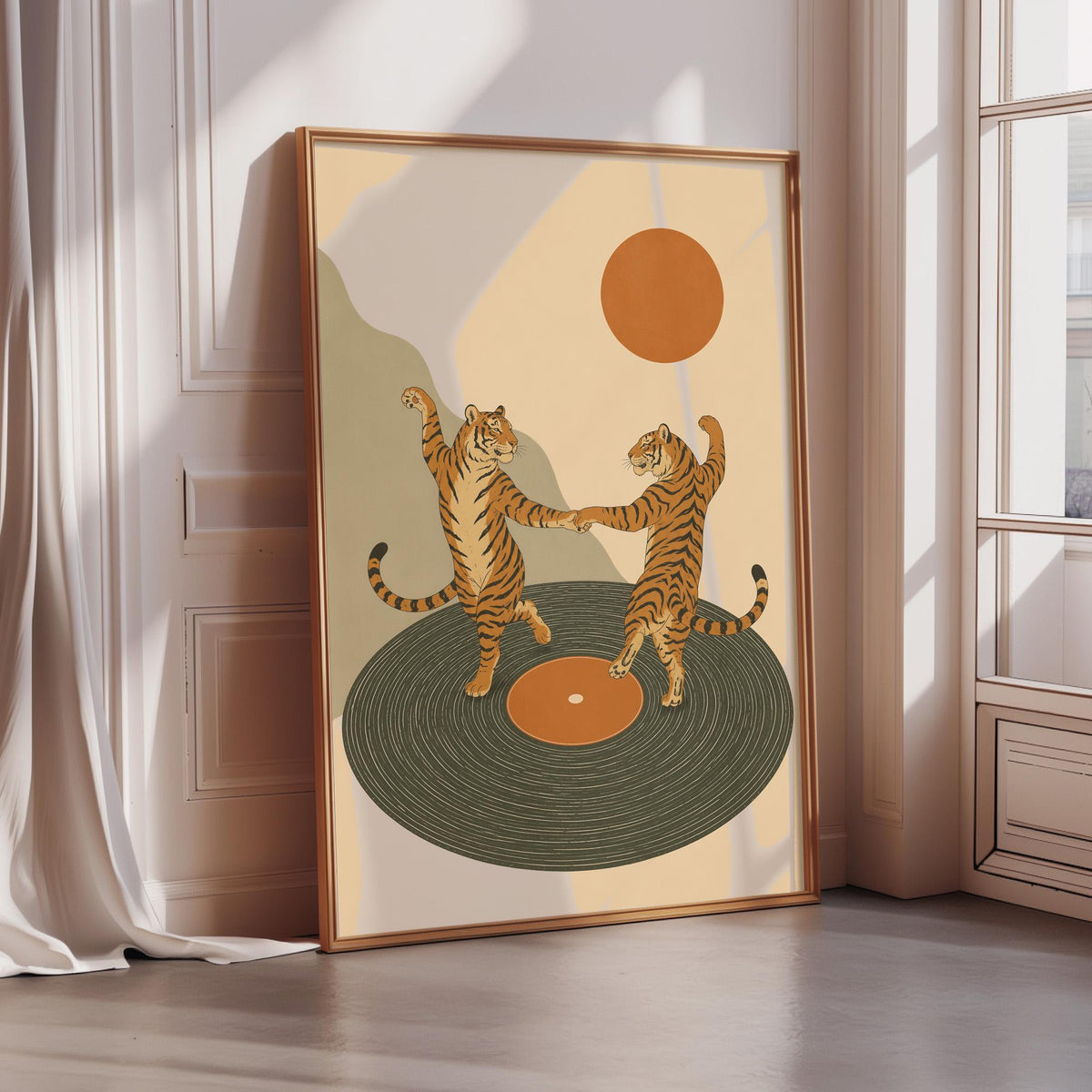 a framed illustration of two dancing tigers on a record player.