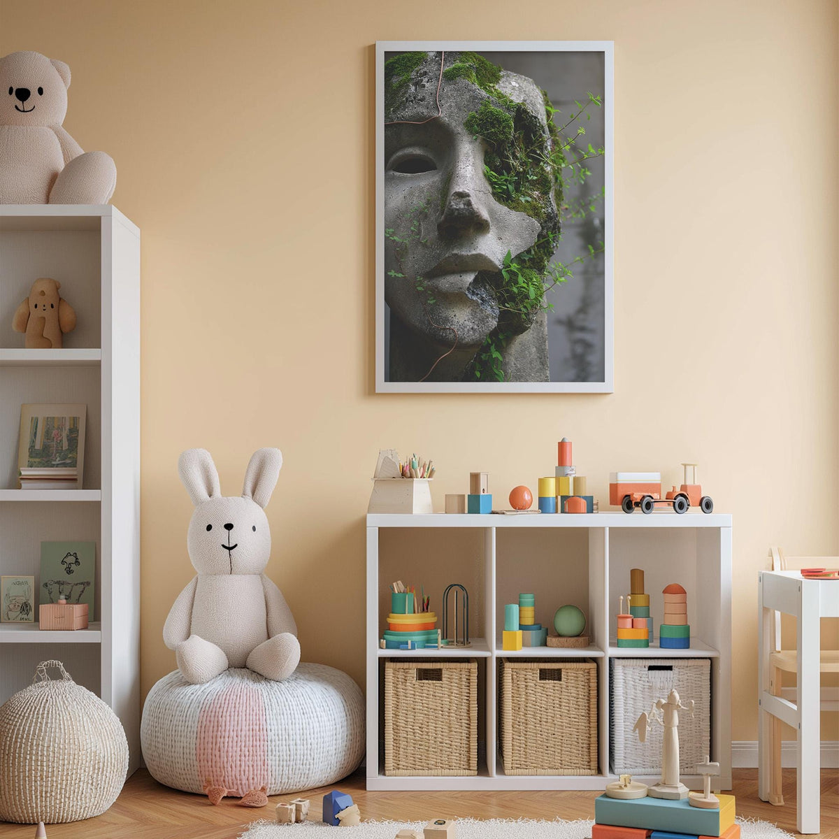 A cozy children's room with a white bookshelf, a plush rabbit, and a colorful toy box filled with toys. A framed image of a stone face with moss growing on it is displayed on the wall above the toy box.