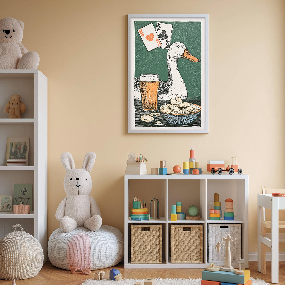 A child's bedroom with a white bookshelf, a stuffed rabbit, a toy train, and a framed illustration of a duck and playing cards on the wall.