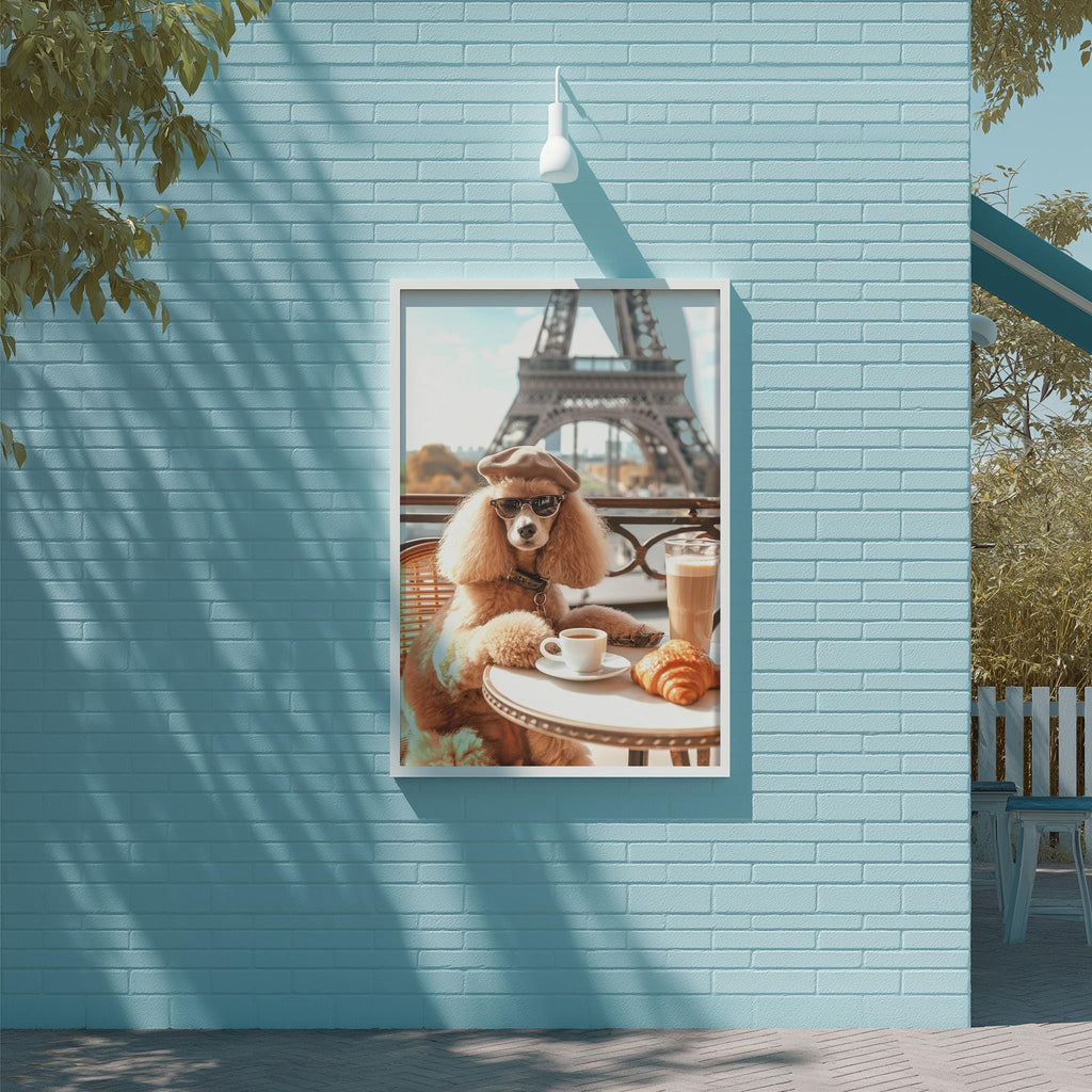 A poodle wearing sunglasses is sitting at a table with a cup of coffee and a croissant, with the Eiffel Tower visible in the background.