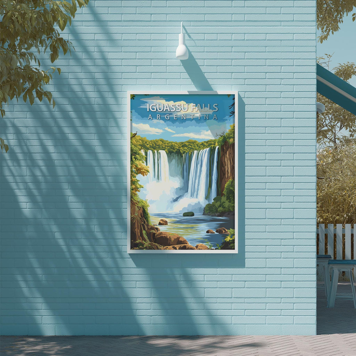 A framed poster of a waterfall is displayed on a light blue brick wall, with a white light fixture above it.