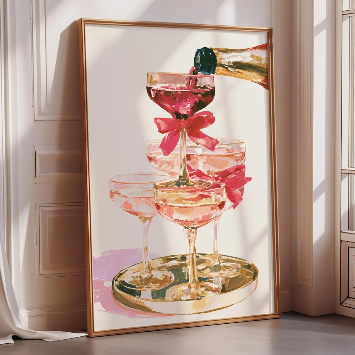 A framed painting depicting a glass of wine with a pink ribbon, surrounded by other glasses of wine, on a table.