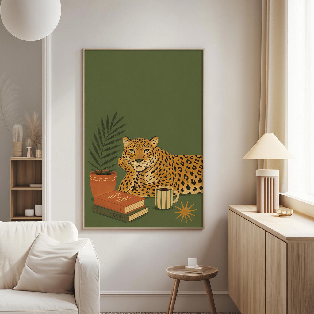 a large framed poster of a leopard resting on a bookshelf, with a lamp and a plant nearby.