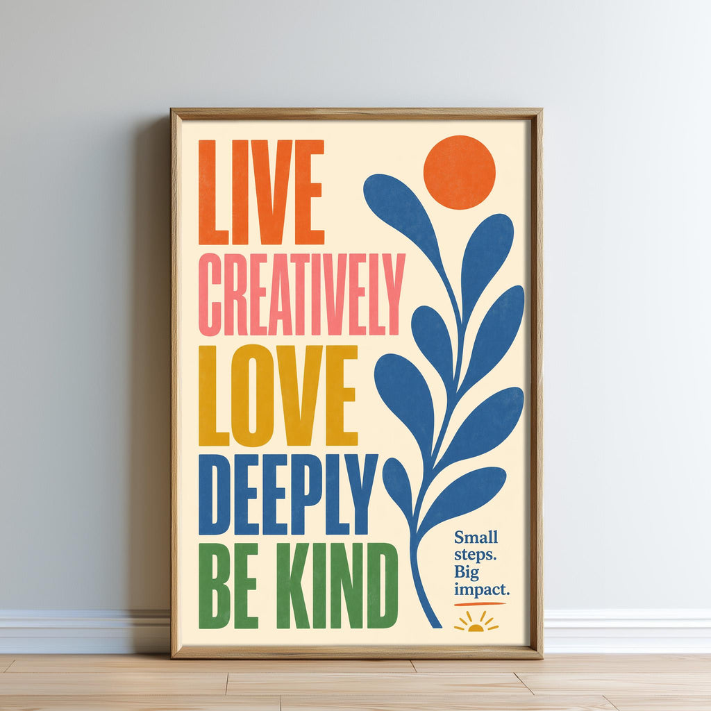 The image is a framed poster with a vibrant design featuring a sun and leaves, accompanied by the text "Live Creatively, Love Deeply, Be Kind" in a colorful, artistic style.