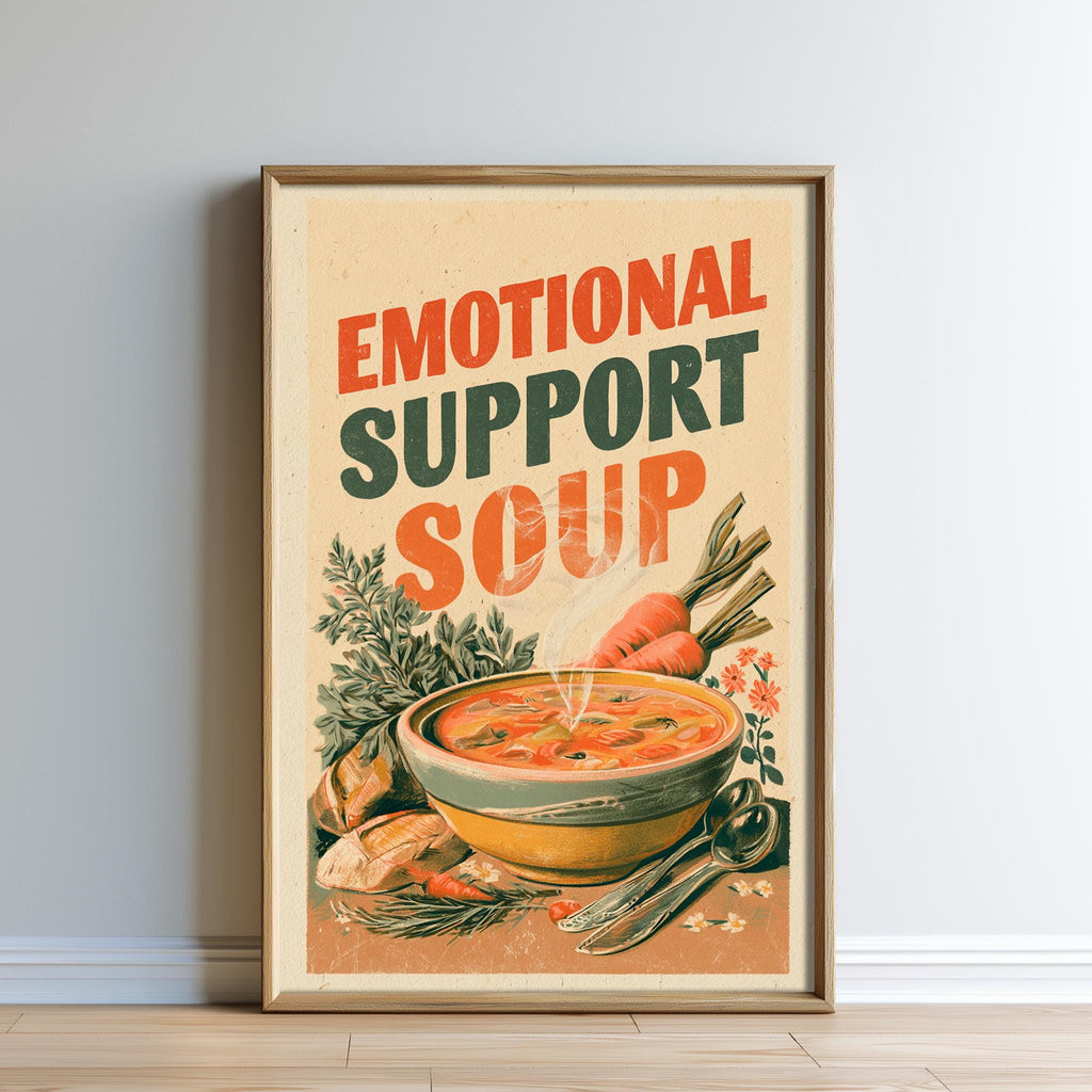 The image is a framed poster with a picture of a bowl of soup and various vegetables, along with the text "Emotional Support Soup" written on it.