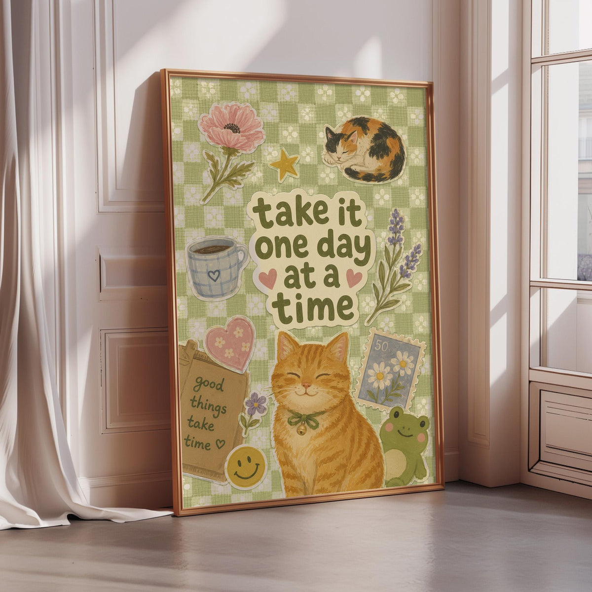 The image is a framed poster with a cat, flowers, and other decorative elements, along with the text "Take it one day at a time".
