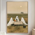a cozy living room with a large painting of three ghostly figures sitting at a table in a field, with a small black cat on the table.