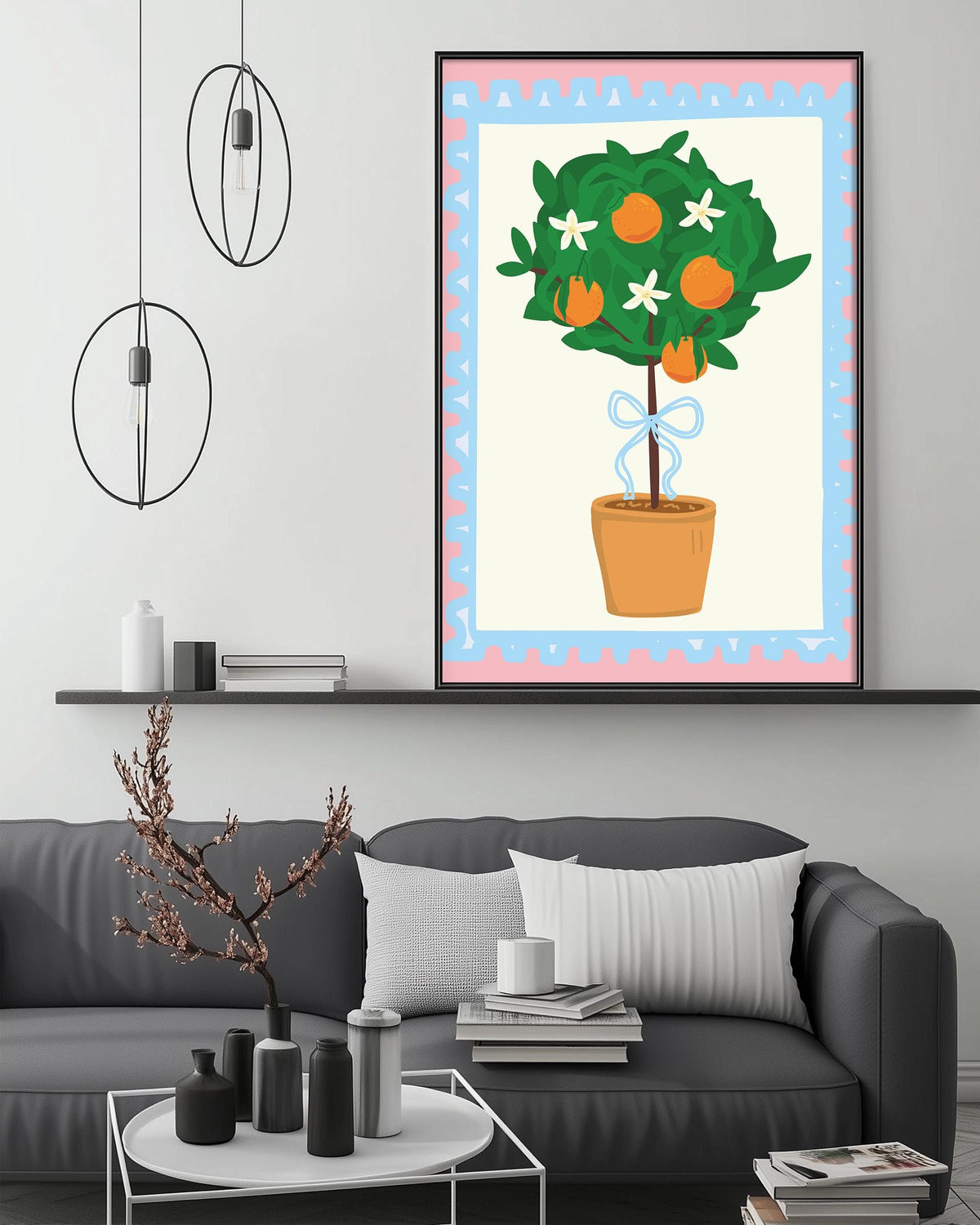 a cozy living room with a gray sofa, a coffee table, and a large framed illustration of a potted tree with orange flowers hanging on the wall above the sofa.
