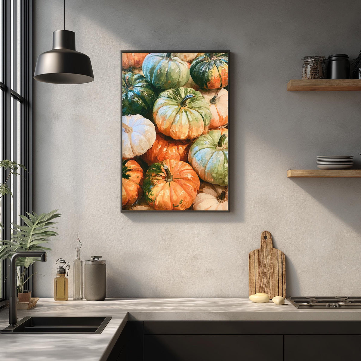 a kitchen counter with a framed painting of pumpkins hanging on the wall above it. The painting displays a variety of pumpkins in different sizes and colors, creating a vibrant and festive atmosphere.