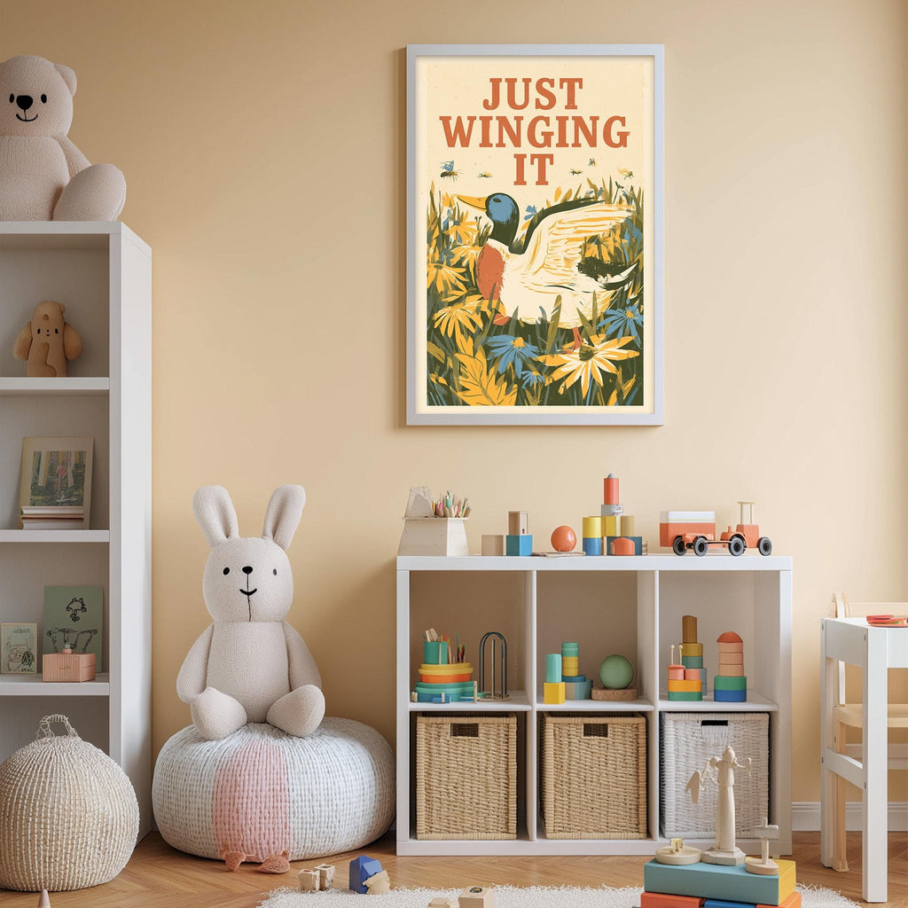 A child's bedroom with a bookshelf, stuffed animals, and a toy train set. A framed poster with a duck and the text "Just Winging It" is displayed on the wall above the bookshelf.