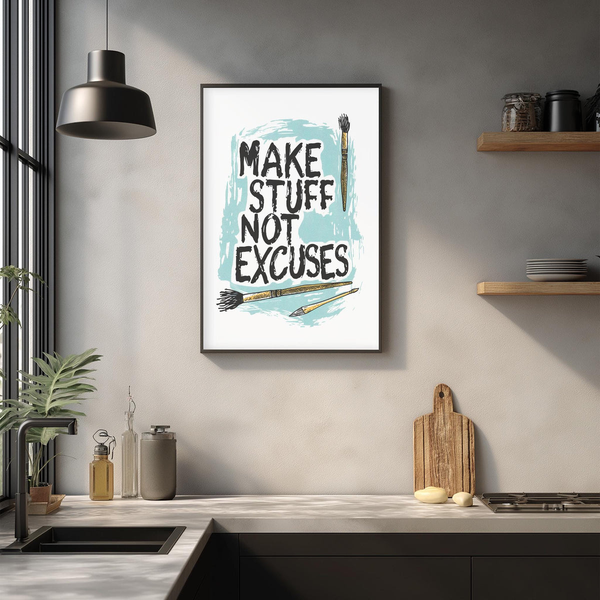a kitchen counter with various kitchen items, such as a cutting board, a knife, and a bottle. Above the counter, there is a framed poster with the text "MAKE STUFF NOT EXCUSES" written on it.