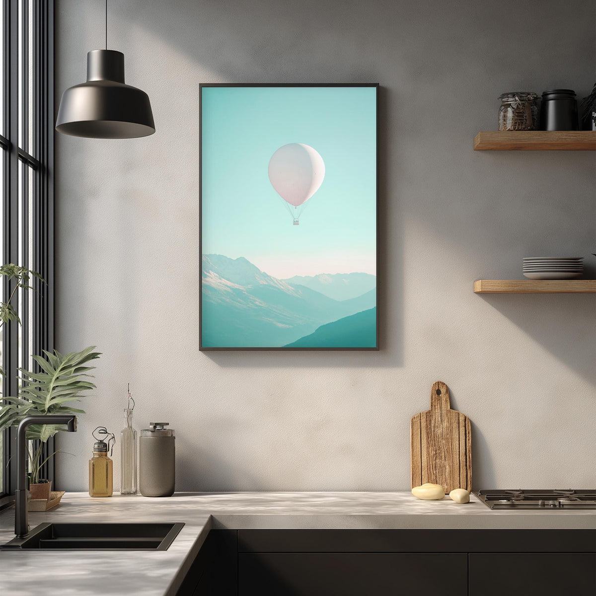a kitchen counter with various kitchen items, including a cutting board, a sink, and a potted plant. Above the counter, there is a framed picture of a hot air balloon floating in the sky, adding a whimsical touch to the space.