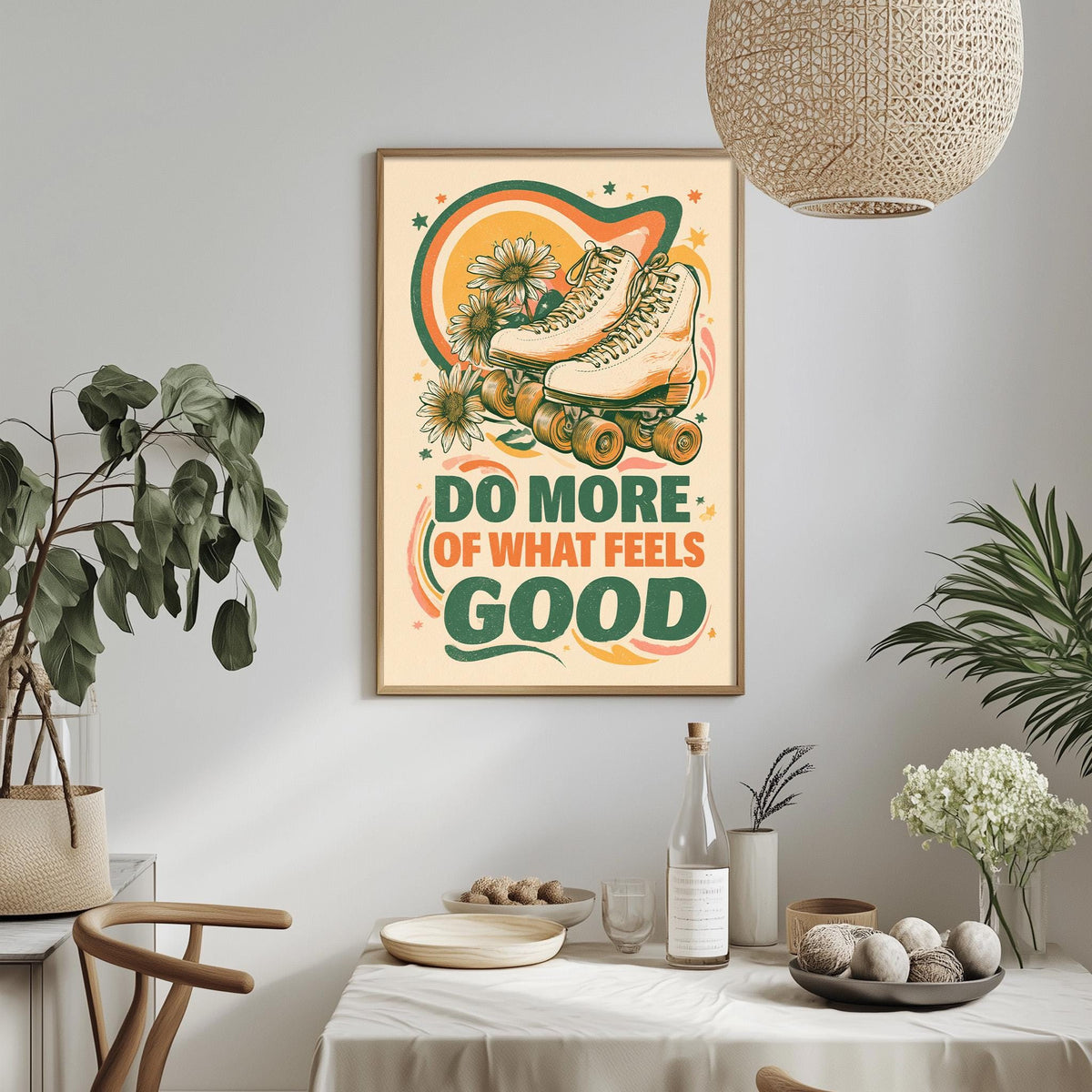 a framed poster with a rollerblading design and the text "Do more of what feels good" hanging on a wall above a dining table with various items on it.