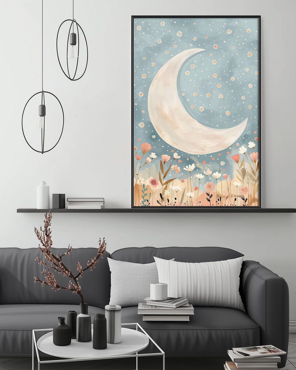 a cozy living room with a gray sofa, a coffee table, and a framed artwork depicting a crescent moon and a field of flowers. The artwork is hanging on the wall above the sofa, creating a serene and inviting atmosphere in the space.