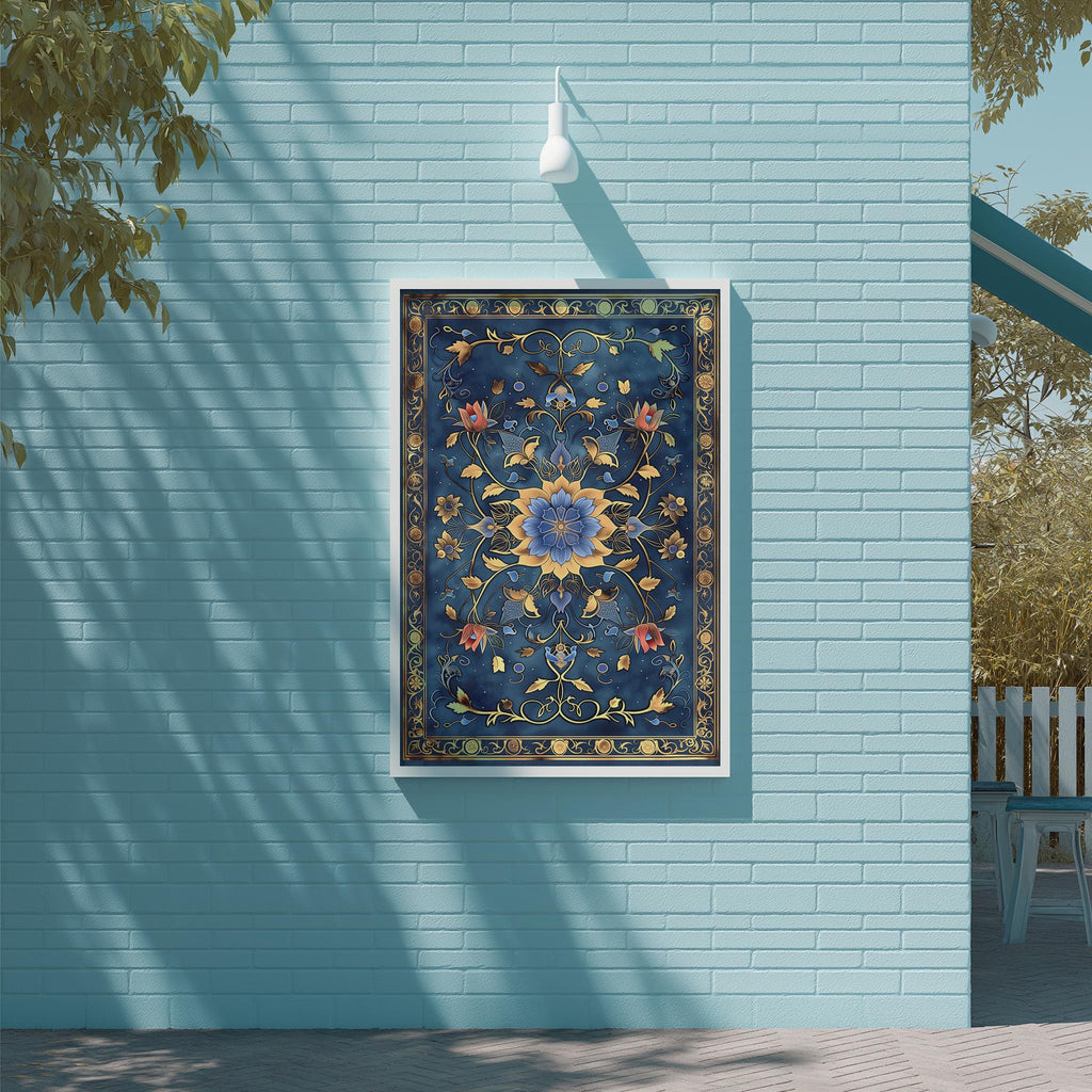a blue wall with a framed artwork hanging on it. The artwork is a large, ornate piece with a floral design in shades of blue and gold. The wall is situated next to a wooden deck and a white railing, creating a serene and inviting outdoor setting.