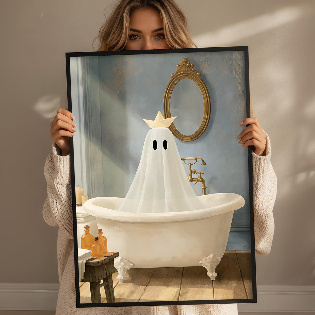 A woman holds up a framed image depicting a ghost in a bathroom, with a white bathtub, gold fixtures, and a mirror.