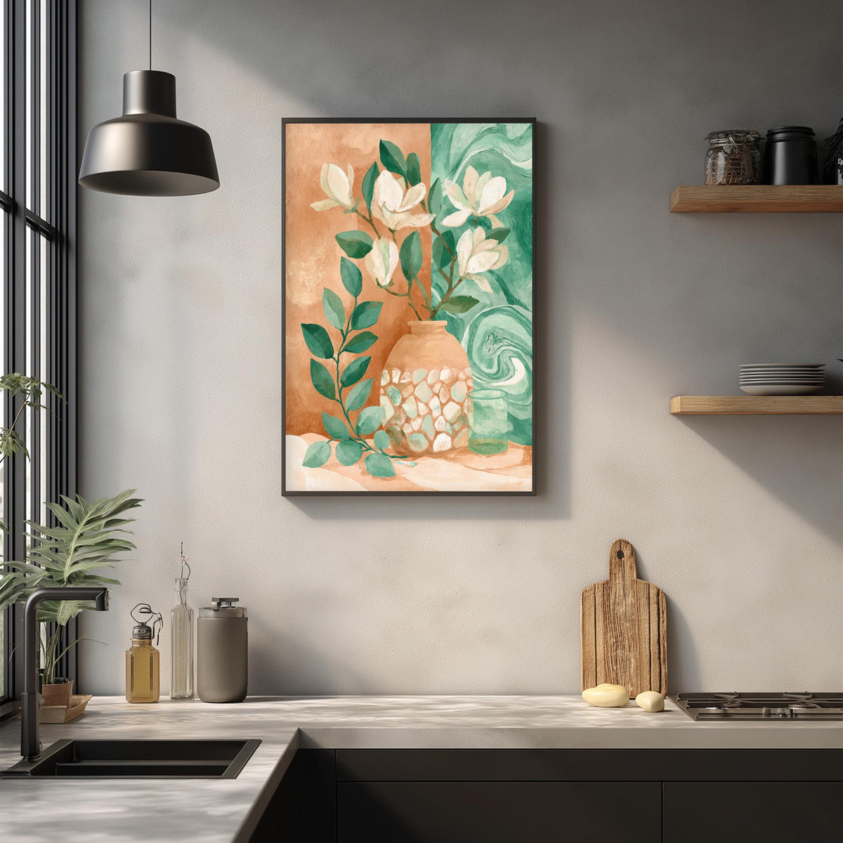 a kitchen counter with a framed painting of flowers and leaves hanging above it. The painting has a warm, earthy color palette with shades of orange, green, and white. The kitchen counter also has various items such as a cutting board, a soap dispenser, and a plant.